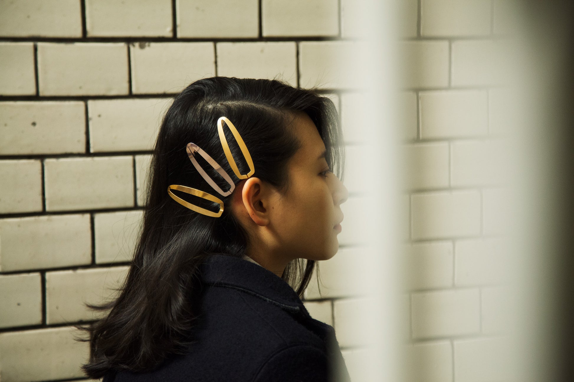 Side view of model wearing her hair down accented with several hair clips Gaia by Clinq