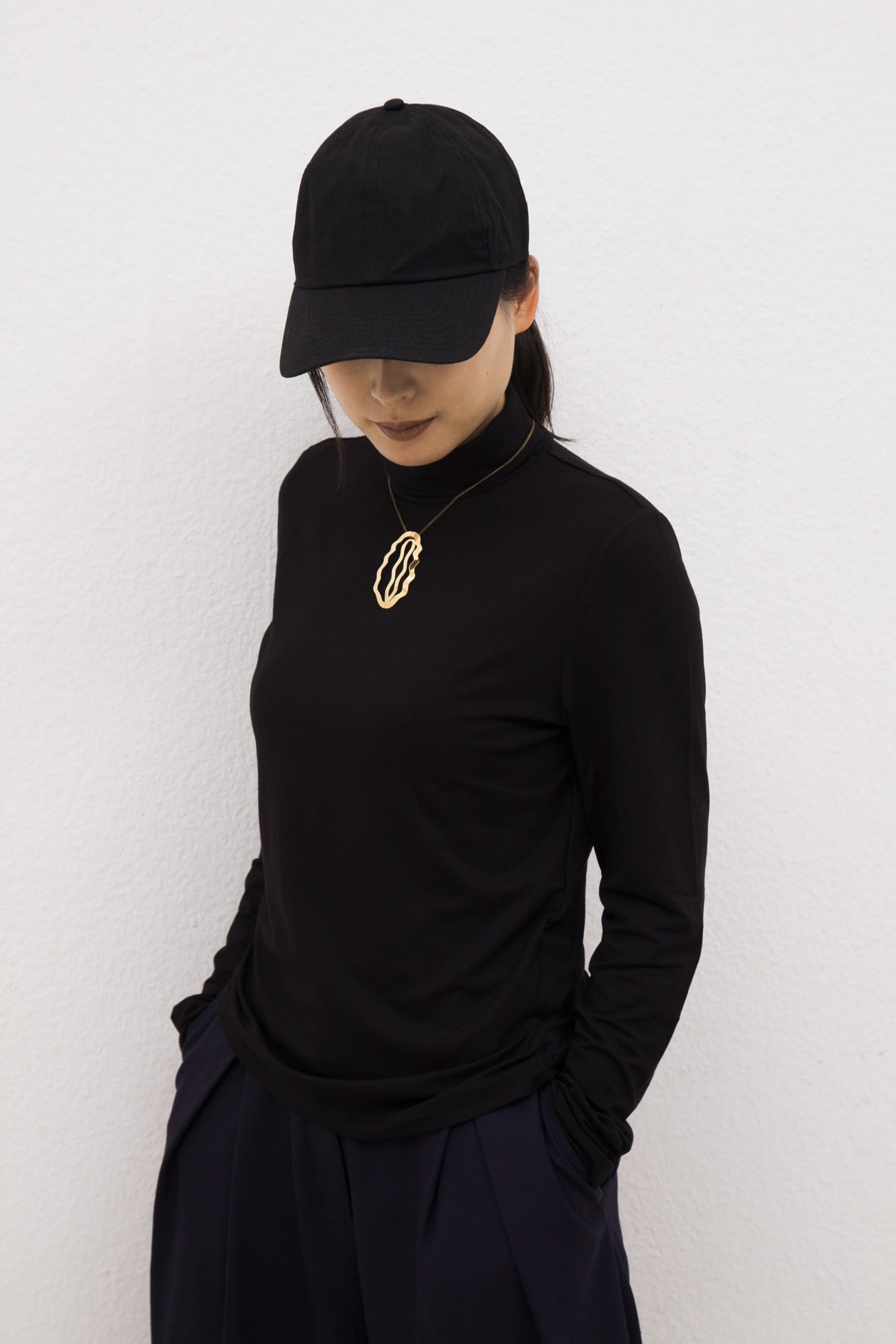 Model wearing her hair clip as necklace