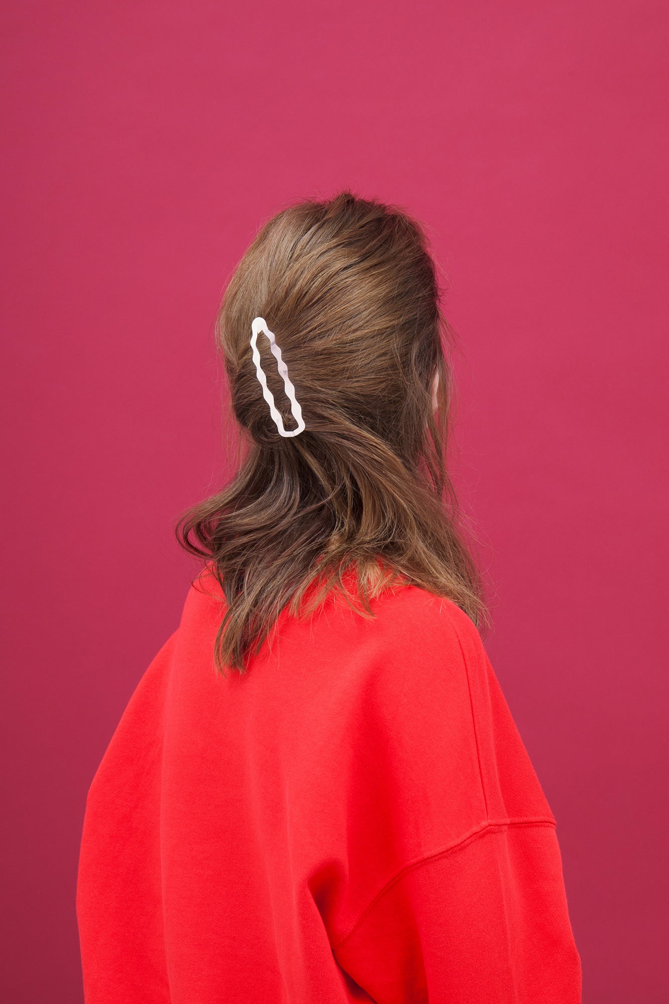 Twisted half updo hold in place with Clinq hair clip Frances