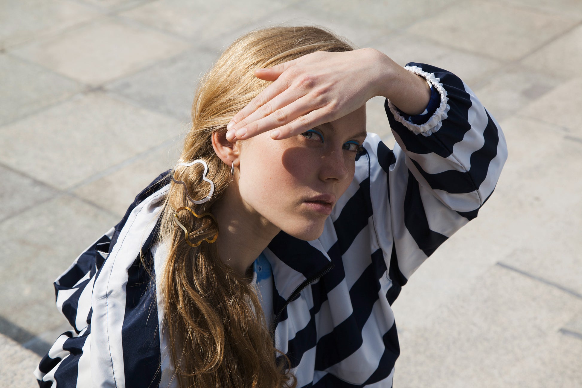 Model wearing a low ponytail with Designer hair clips Greta by Clinq