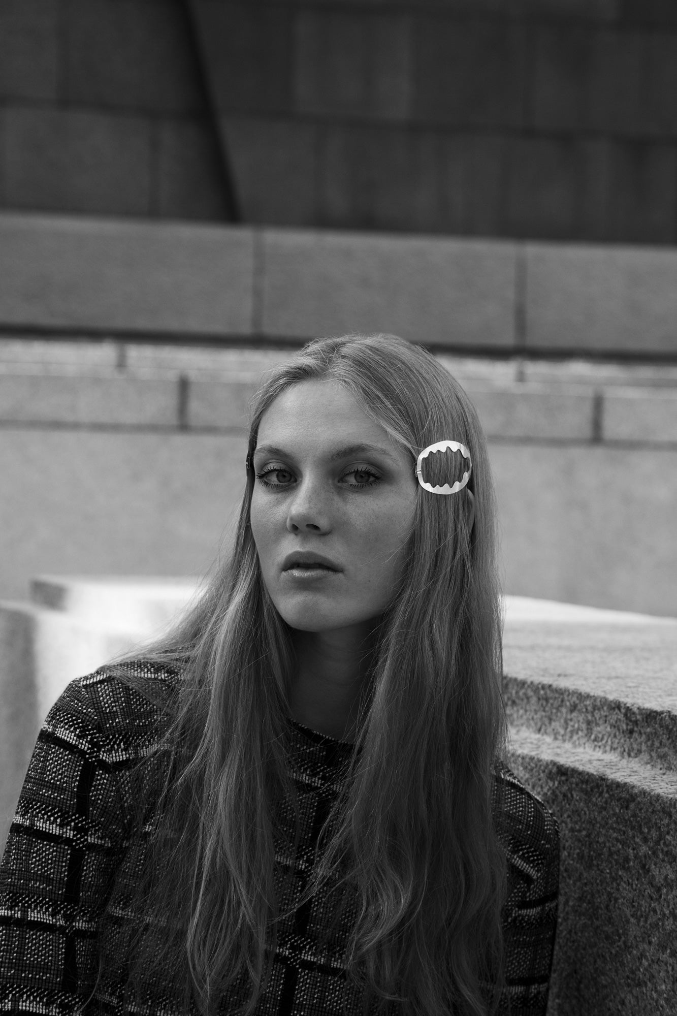 Front view of model wearing her hair down highlighted with designer hair jewelry Ida by Clinq