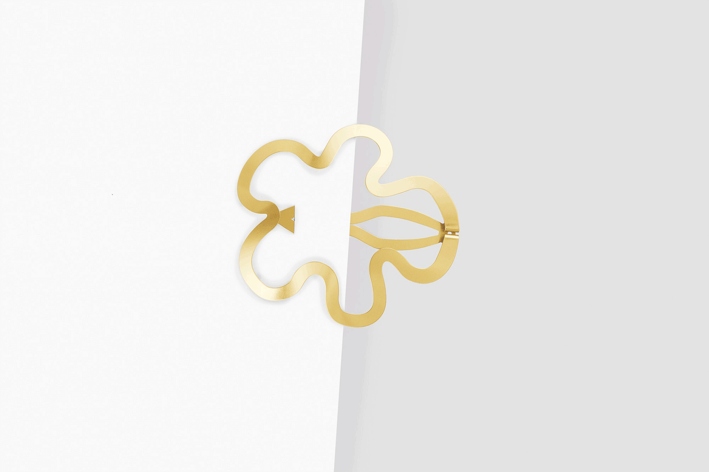 Product images of designer hair clip Hilma. Barrettes are clipped in half way to show the unique shape