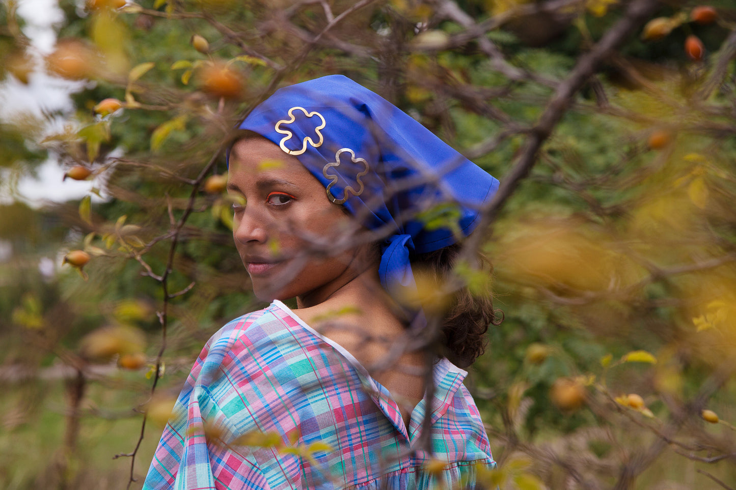 Model wearing a blue headscarf accessorized with designer hair clip Hilma.