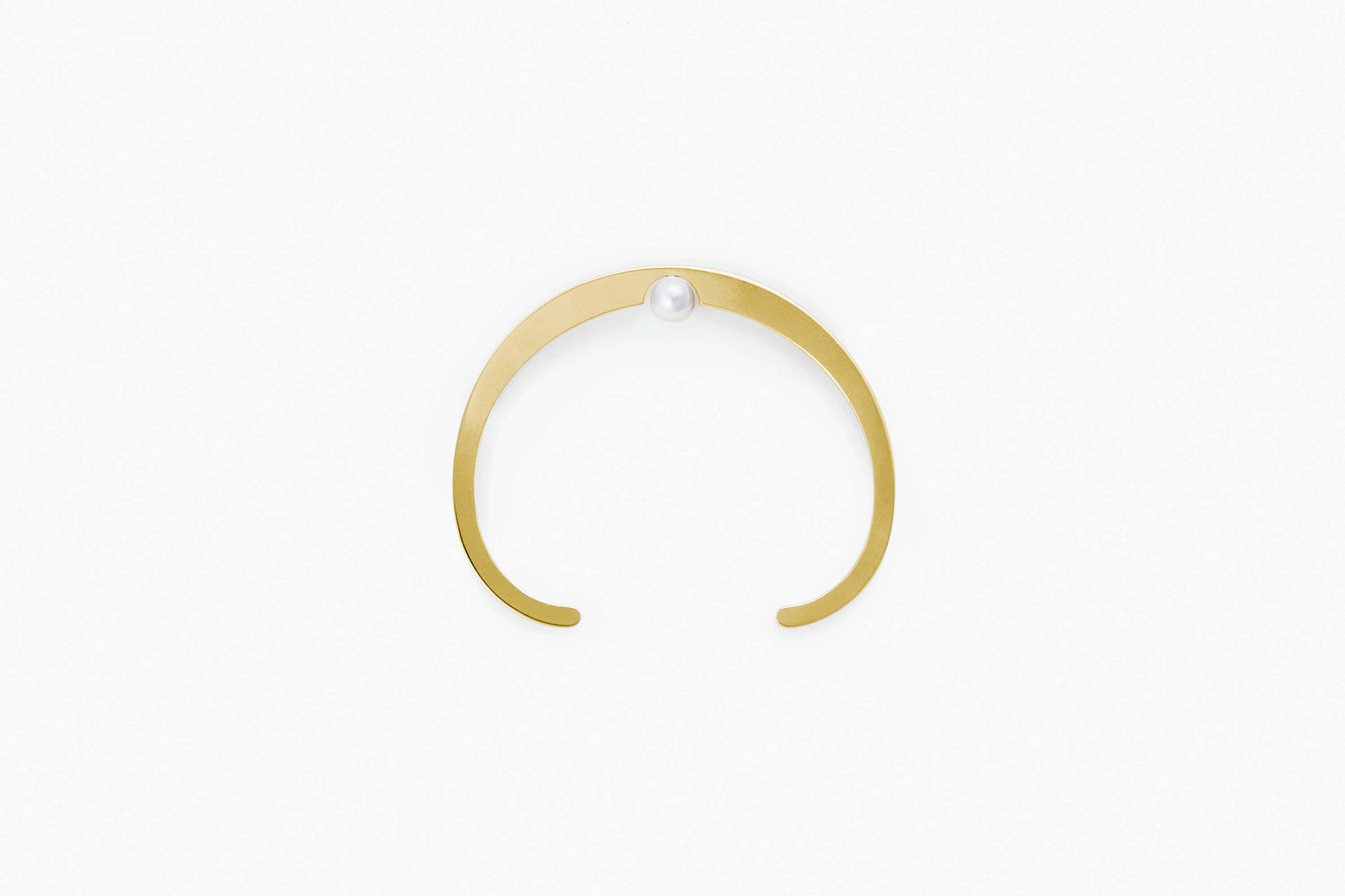 Product image of designer bangle Ivy. Available in Silver-Tone and Gold-plated accented with freshwater pearl