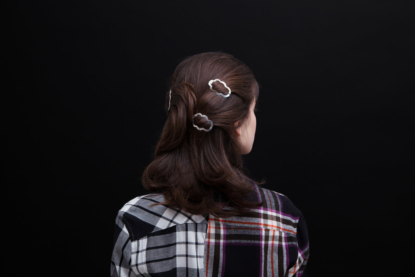 Back view of model wearing her hair down styled with designer hair clip Camille by Clinq