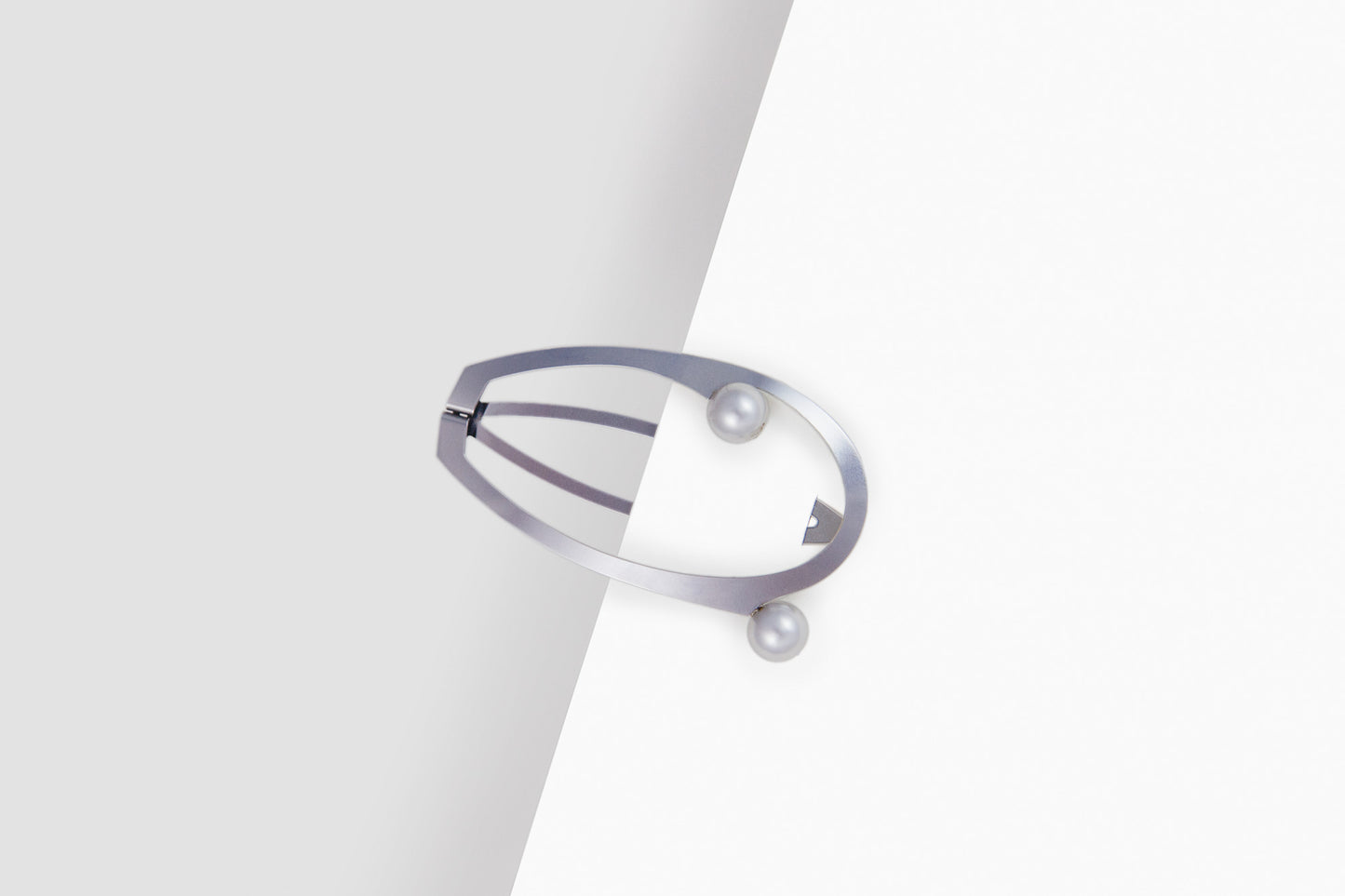 Designer hair clips made from stainless steel embellished with silver coloured shell pearls