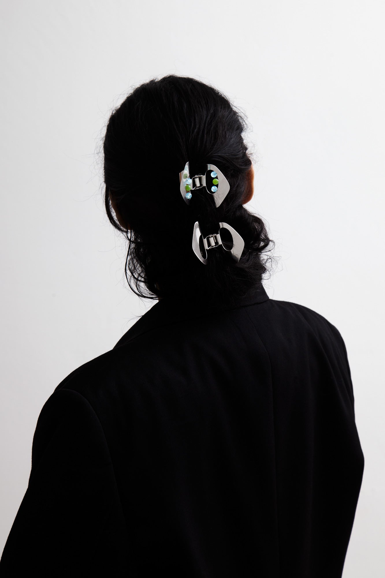 Model with her hair in a up do secured with stainless steel designer claw clip YARA and MARLA by CLINQ