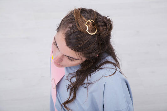 Loose top knot secured with designer hair clip ALISA. Handmade by CLINQ